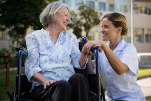 Residents tend an accessible garden beside an energy-efficient assisted living building.